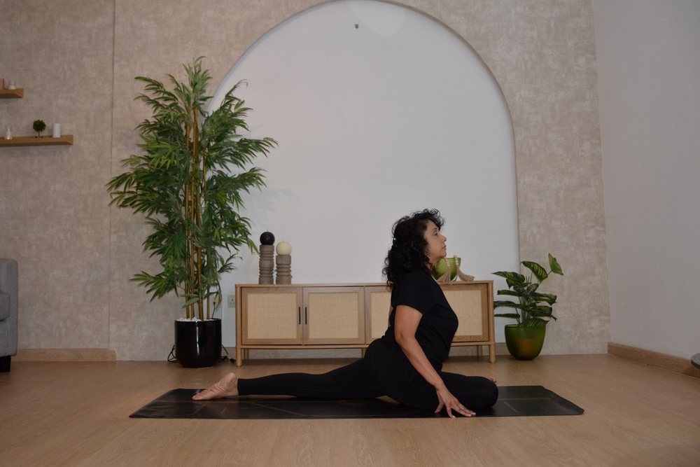 Shipra in a half pigeon pose