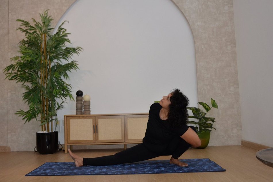 Shipra in a seated spinal twist
